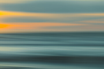 Abstract seascape. Image displays blue, yellow, and light turquoise split-toned color scheme.
