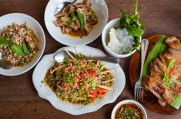 papaya salad on the table, thai spicy food