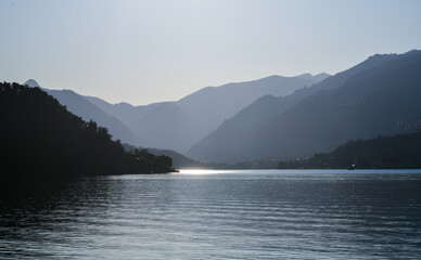 Beautiful sunset view of Alp Mountains silhouette at Lake Como, Italy.