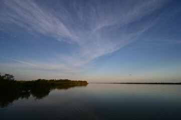 Fototapeta na wymiar Ethereal high altitude clouds at dusk over West Lake in Everglades National Park, Florida