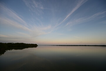 Ethereal high altitude clouds at dusk over West Lake in Everglades National Park, Florida