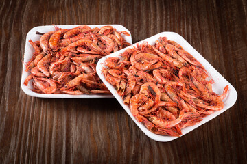 Dried shrimp on wooden background