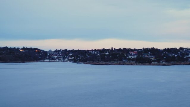 City Coastline From Ferry Travelling Across Ocean