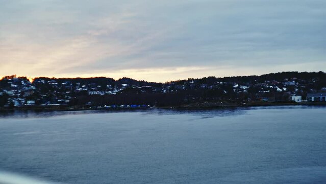 City Coastline From Ferry Travelling Across Ocean