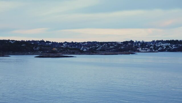 City Coastline From Ferry Travelling Across Ocean