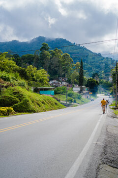 landscape of a tropical city, calarca quindio, with road next to the mountains. vertical photo