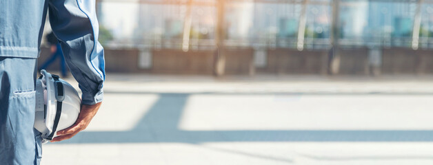 Banner Engineer man hands holding hardhat white work helmet hard hat Construction Engineering....