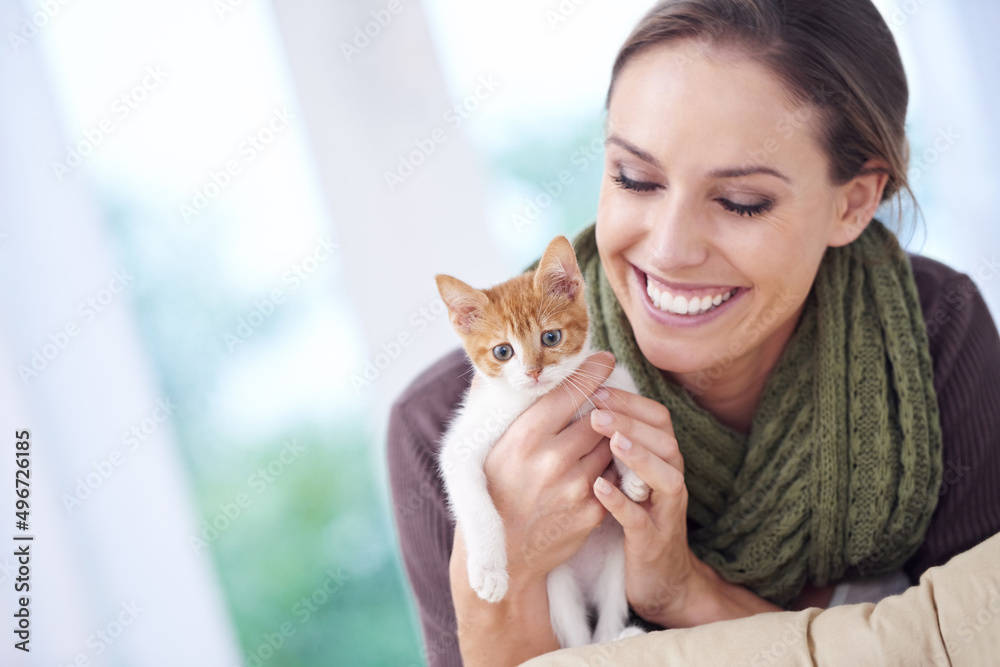 Canvas Prints Time spent with cats is never wasted. Shot of an attractive young woman holding a kitten.