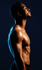 Fototapeta premium Strengthen your mind, strengthen your body. Studio shot of a fit young man posing against a black background.