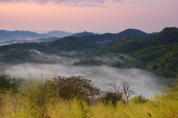 Fototapeta na wymiar Aerial view Beautiful of morning scenery Golden light sunrise And the mist flows on high mountains. Pang Puai, Mae Moh, Lampang, Thailand.