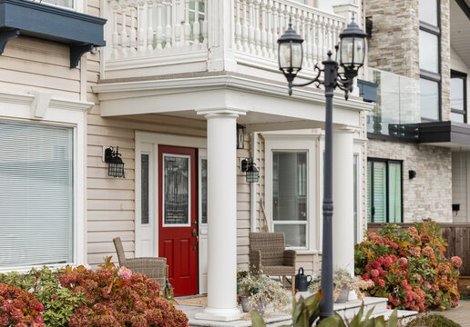 Entrance Of A Luxury House With A Patio. Home Exterior With Patio Area With Nice Landscaping Desing Around