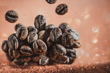 closeup of coffee beans against a shiny black background. coffee background. copy space with coffee beans. coffee beans on the dining table. closeup of coffee beans