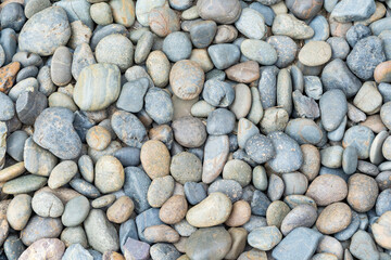 Sea colorful pebbles on the beach.