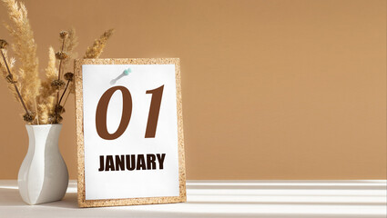 january 1. 1th day of month, calendar date.White vase with dead wood next to cork board with numbers. White-beige background with striped shadow. Concept of day of year, time planner, winter month