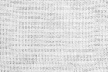 Fototapeta na wymiar White fabric jute hessian sackcloth canvas woven gauze texture pattern in light white color blank decoration.