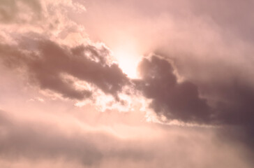 Naklejka na ściany i meble Beautiful romantic clouds with sun in the sky