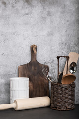 Culinary background with kitchen utensils for baking. Crockery and kitchen utensils for cooking on the table. Front view