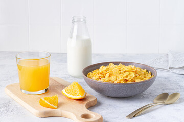 Corn flakes breakfast with milk on the table