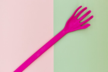 Stylized plastic hand isolated on palette color background