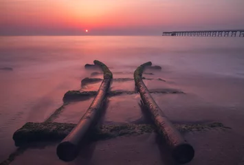 Fotobehang Aubergine zonsondergang op het strand