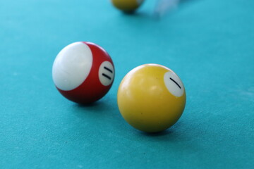 billiard table and colorful balls