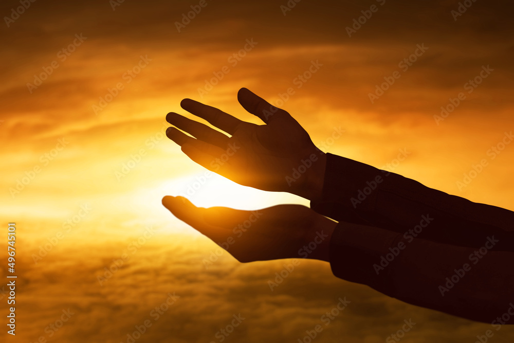 Wall mural muslim man praying at sunset