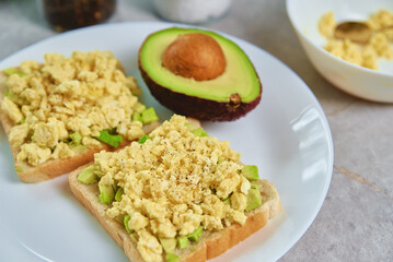 Toasts with avocado and egg on white plate, Healthy food and dieting concept, Organic product