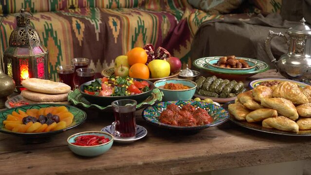 The Islamic holiday of Eid ul-Fitr marks the end of the Islamic fasting of the month of Ramadan. Traditional Eastern food and meal are on the table.