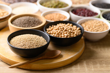 Various cereal, grain, bean, legume and seed in bowl on wooden background, Food ingredients
