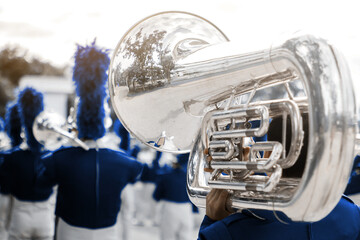 School band performs in marching band, percussion and trumpet and saxophone