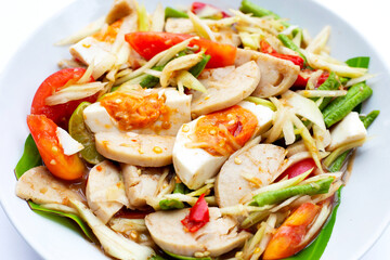 Spicy papaya salad with salted egg and vietnamese pork sausage