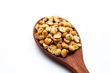 Roasted peanuts on white background.