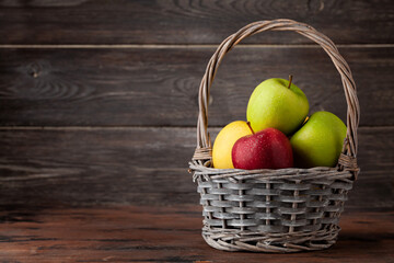Colorful ripe apple fruits in basket