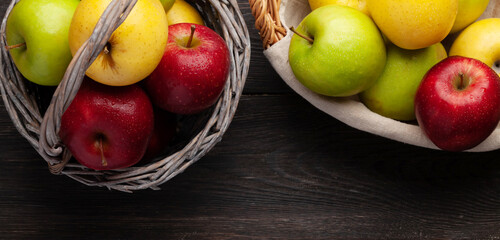 Colorful ripe apple fruits in basket