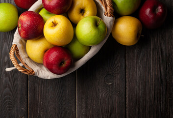 Colorful ripe apple fruits in basket