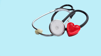 Heart and stethoscope isolated on blue background. Concept for healthcare and diagnosis measuring...
