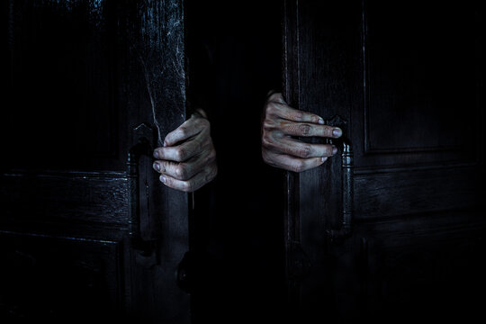 Ghost Hands Open The Wooden Door From The Inside Of The Old Dark Room. Filled With Spider Webs