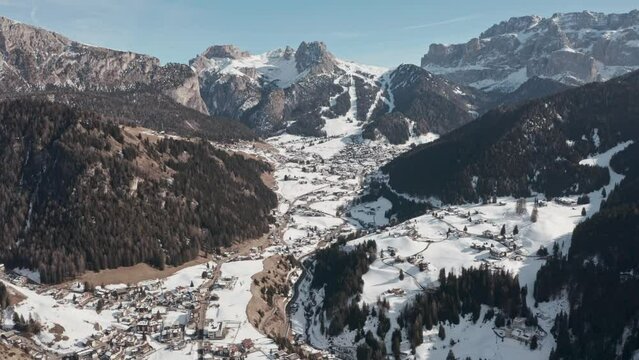 Dolly forward drone shot over Selva Wolkenstein valley dolomites