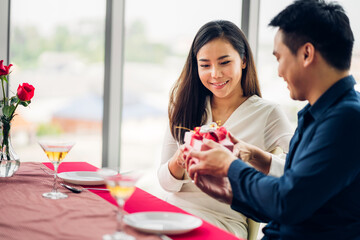 Romantic sweet couple having fun and smiling while celebrating enjoying valentines day time...