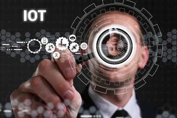 Business, technology, internet and network concept. Young businessman thinks over the steps for successful growth: IOT