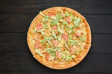 Pizza with squid, shrimps, parmesan and salad