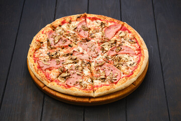 Pizza with beef ham, mushrooms and tomato