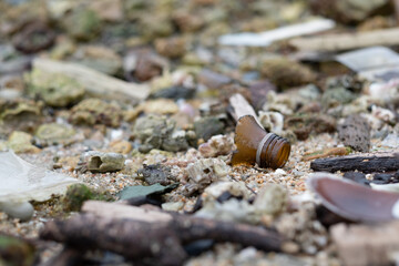 garbage on the beach, dirty sea