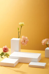 A front view of white podium decorated with flower and yellow background with blank space for advertising 