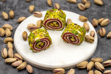 Turkish Delight with Grated Pistachio. Turkish delight with pistachio on a dark background. close up