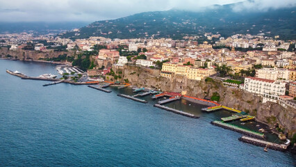 Obraz premium Aerial view of beautiful Sorrento Beach and port at summer sunset, Amalfi Coast - Italy