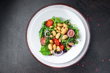 salad bean tomato, onion, lettuce leaves mix fresh healthy meal diet snack on the table copy space food background keto or paleo diet veggie vegan or vegetarian food