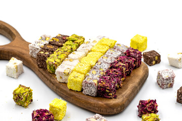 Turkish Delight Double Roasted Gourmet Mix. Assortment of turkish delight isolated on white background. Delights cut into small slices. close up