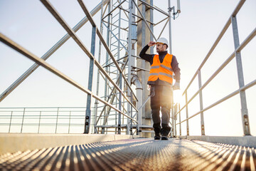An industry worker walking on top of the silo. © Dusan Petkovic
