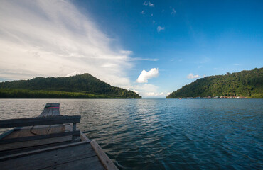 Tradition Thai wooden boat into the Mangrove forest sea of Thailand